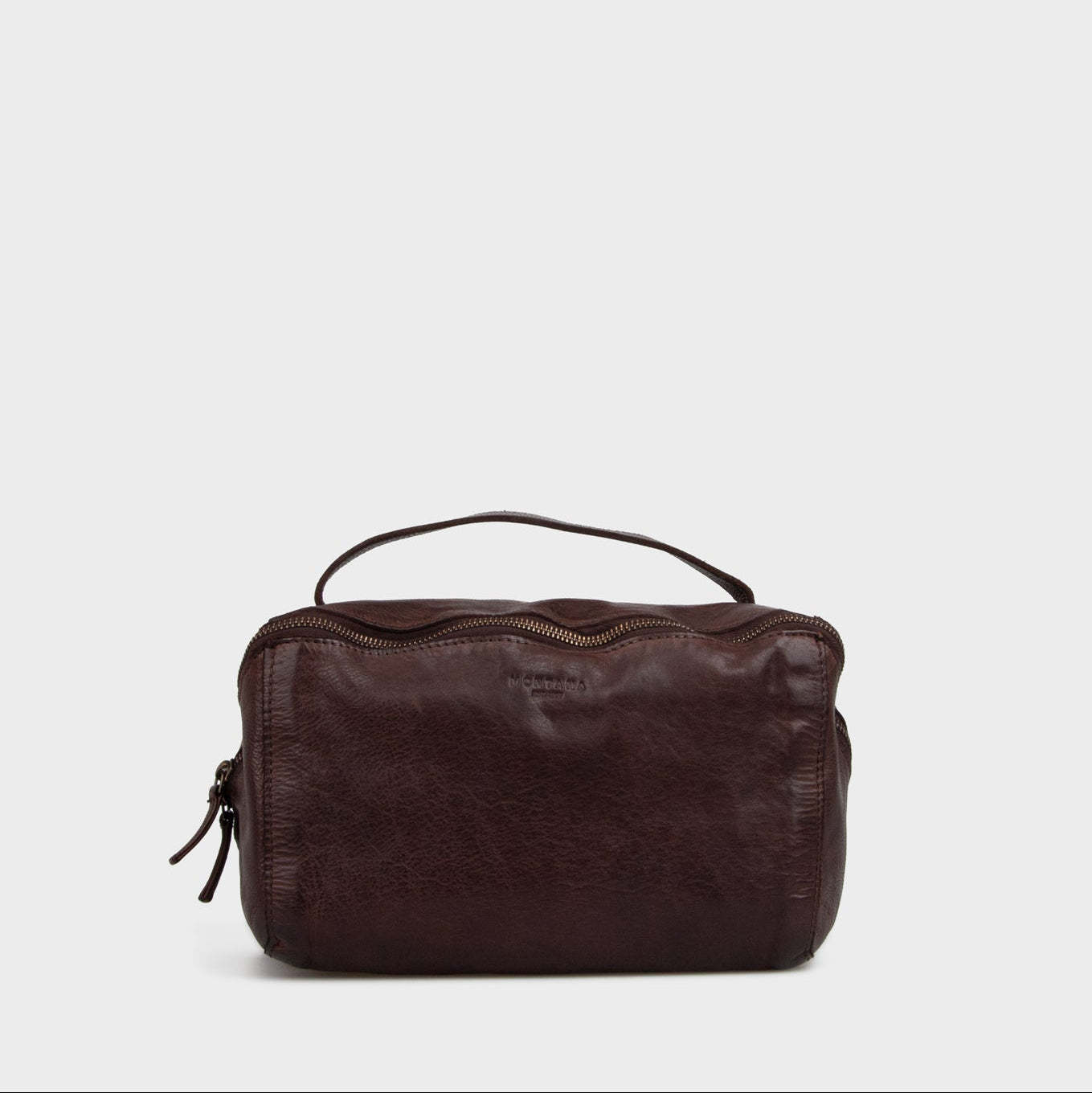 Mørkebrun toilettaske der kan åbne sig op på kryds