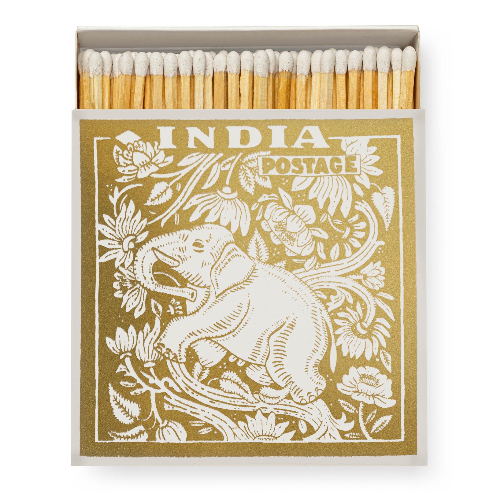 Stor tændstikkeæske i guld med en elefant på