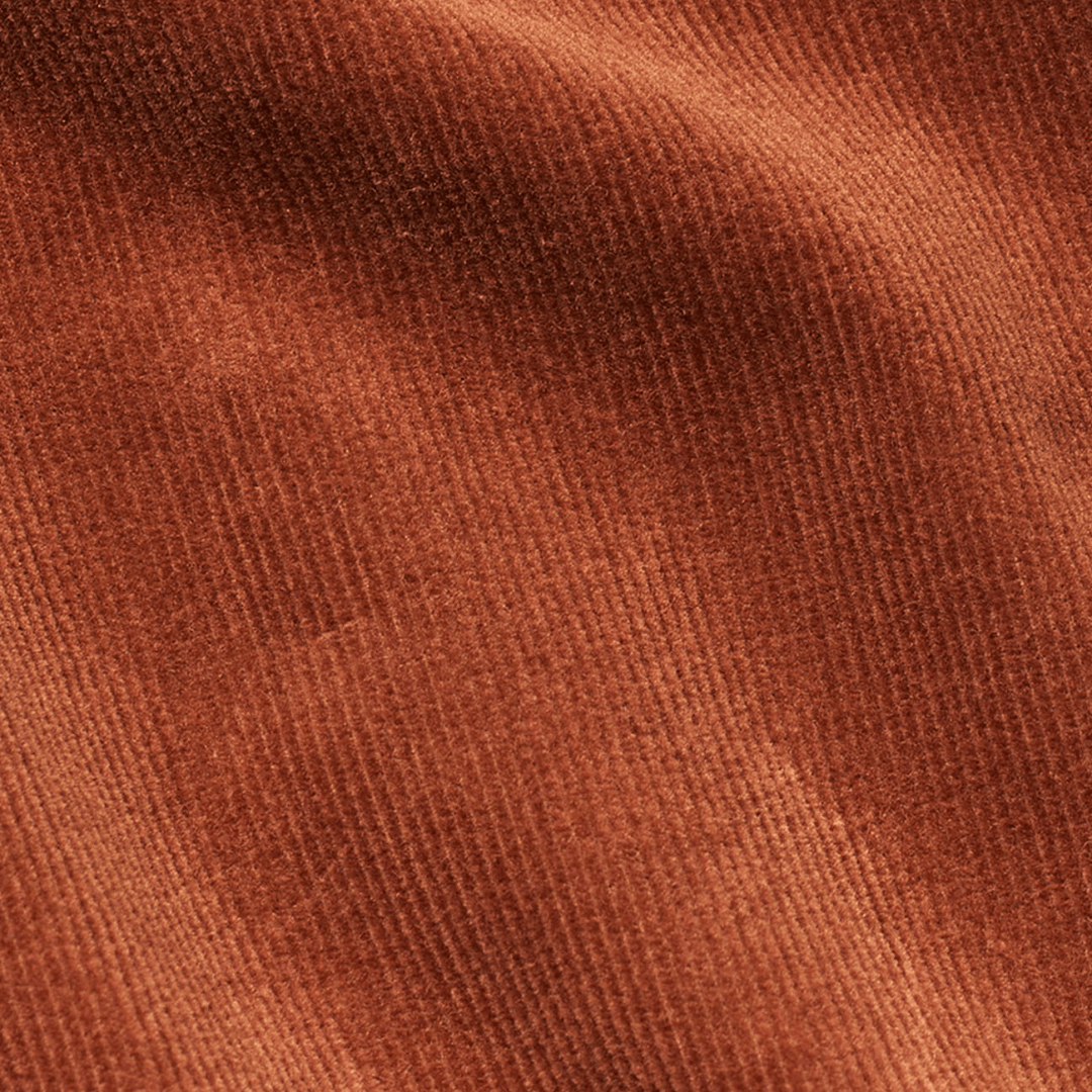 Five Units fløjs bukser i en orange ligende farve - close up af stoffet og farven