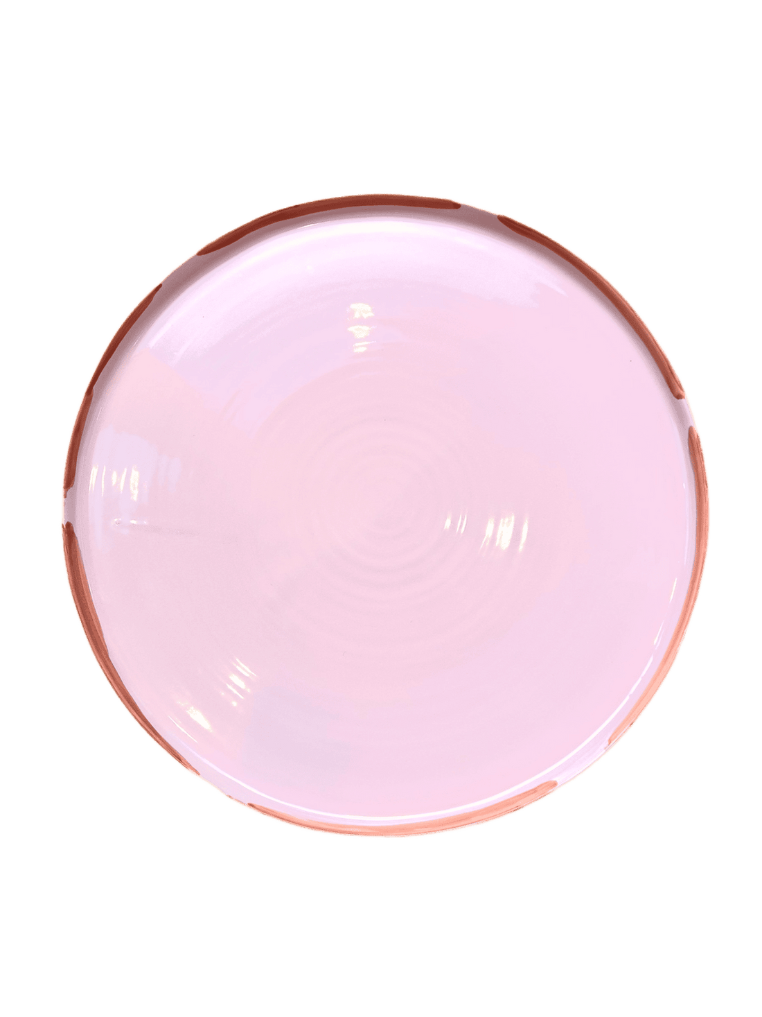 Stort lyserød fad med en orange kant