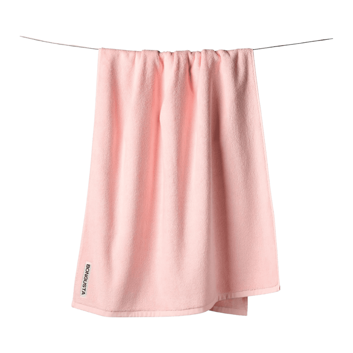 Et lyserødt frotte bongusta håndklæde i bomuld - perfekt til det skandinaviske badeværelse