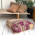 Marokkansk puf i vintage uld med striber i rosa, beige og brunlige nuancer