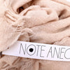 Et lækkert stor tørklæde i en uld og cashmere blanding. Det er svag lyserødt